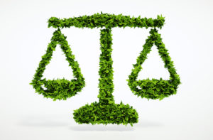 Legal scales with green foliage